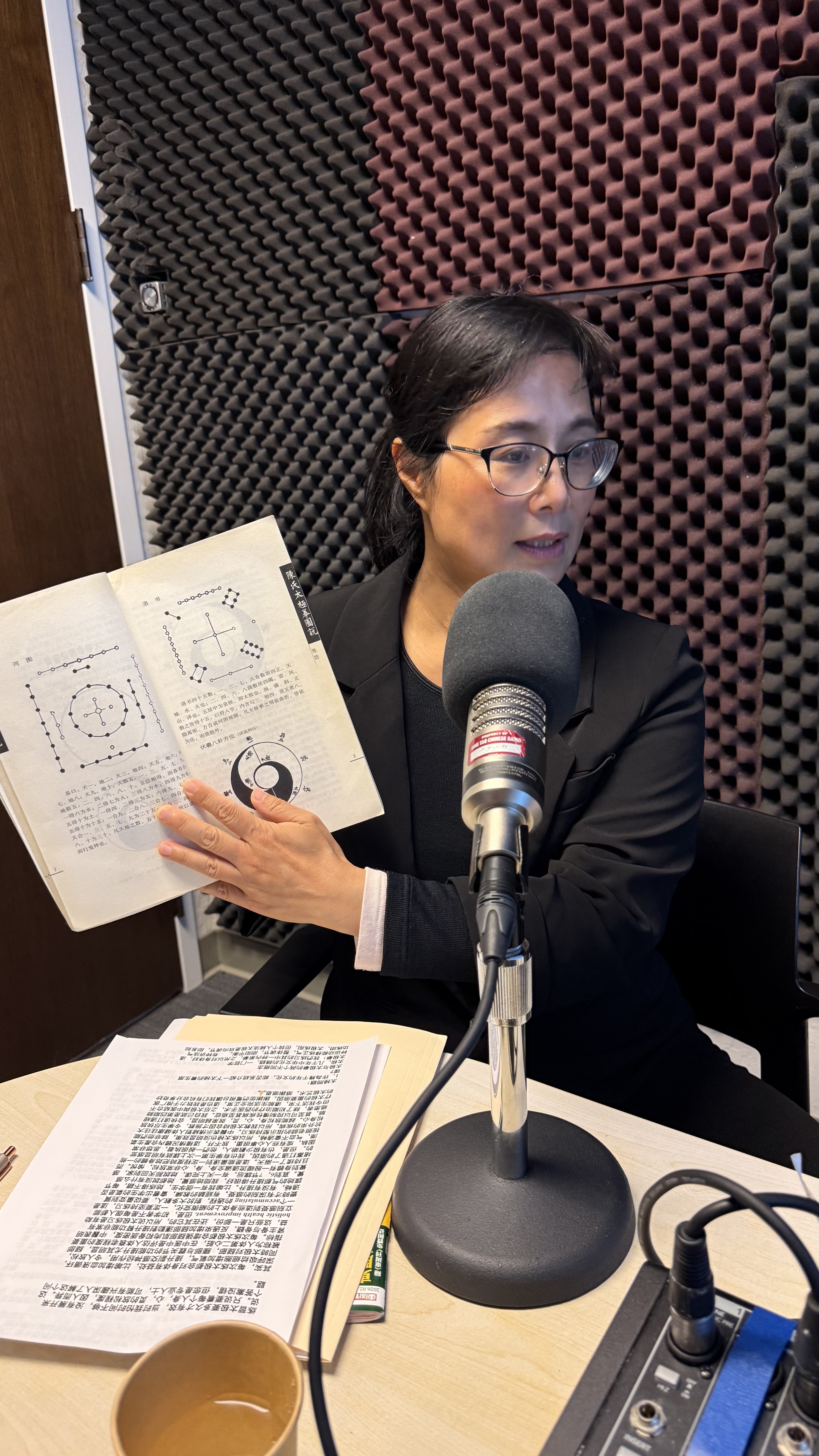 Donna Tse presenting Tai Chi theory during a radio interview